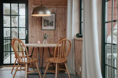 a dining room with a table and two chairs at Fanøy Island Lodge in Fanoyna