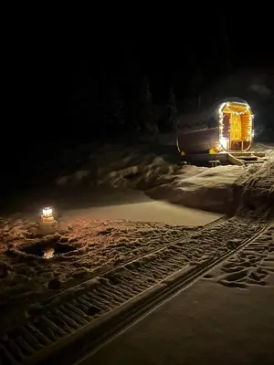 a train track in the snow at night at Vidsyn Midjås in Vistad