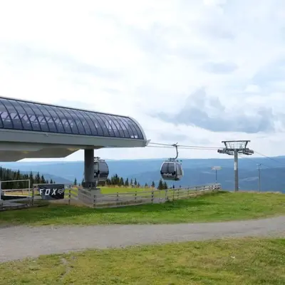 a gondola ride in the sky on a hill at Cozy apartment in Hafjell - Øyer centre in Hafjell
