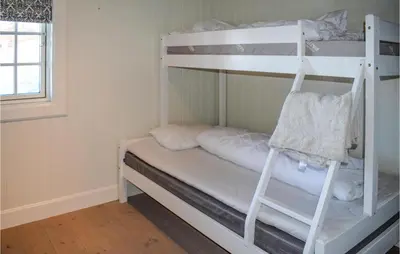 a couple of bunk beds in a room at Gorgeous Home In Rauland in Rauland