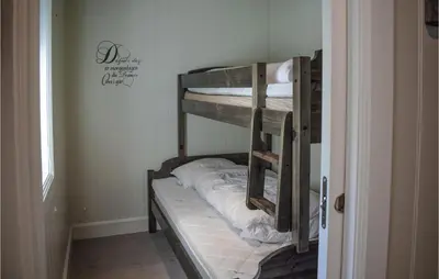 a couple of bunk beds in a room at Gorgeous Home In Rauland in Rauland