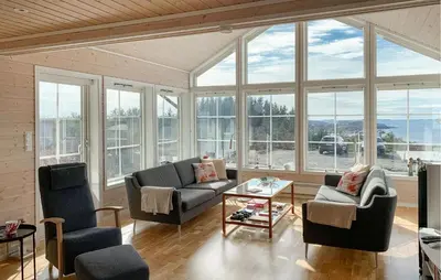 a living room with couches and chairs and windows at Gorgeous Home In Sveio With Wifi in Sveio