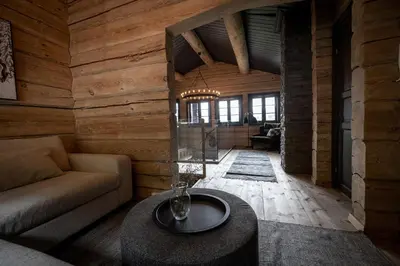 a living room with a couch and a table at Roalden Mountain Lodge in Stranda