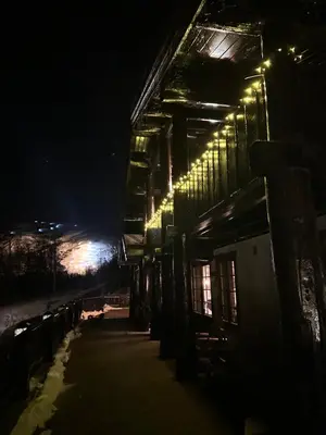 a building with lights on the side of it at night at Roalden Mountain Lodge in Stranda