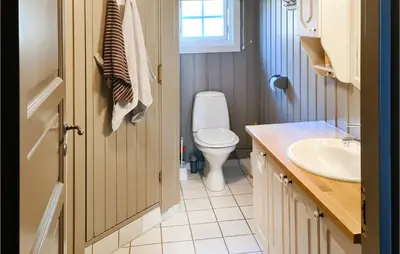 a bathroom with a toilet and a sink at 3 Bedroom Lovely Home In Beitostølen in Beitostøl