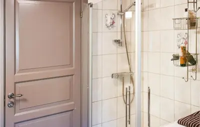 a bathroom with a shower and a door at 3 Bedroom Lovely Home In Beitostølen in Beitostøl