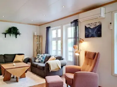 a living room with a couch and a table at 6 person holiday home in Gudvangen-By Traum in Gudvangen
