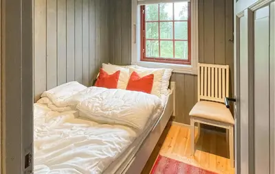 a large bed in a room with a window at 4 Bedroom Cozy Home In Reinli in Reinli