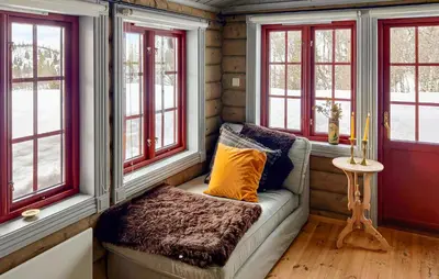 a couch in a room with windows at 4 Bedroom Cozy Home In Reinli in Reinli