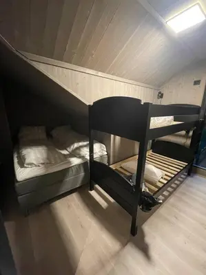 a bunk bed with two bunk beds in a room at Resvegen 63 in Stranda
