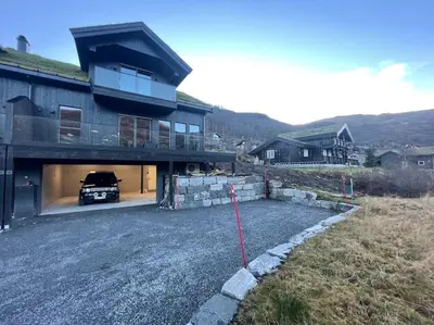 a car is parked in a garage of a house at Resvegen 63 in Stranda