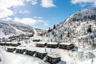 a resort in the mountains covered in snow at Skarsnuten Panorama 46 in Hemsedal