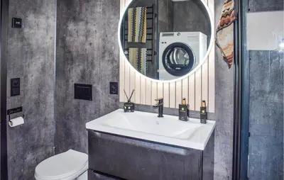 a bathroom with a sink and a mirror at 5 Bedroom Nice Home In Hemsedal in Hemsedal