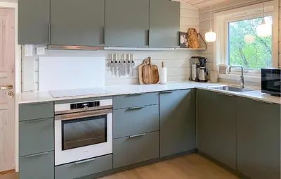 a kitchen with gray cabinets and a sink at Gorgeous Home In Skjold With Kitchen in Skjold