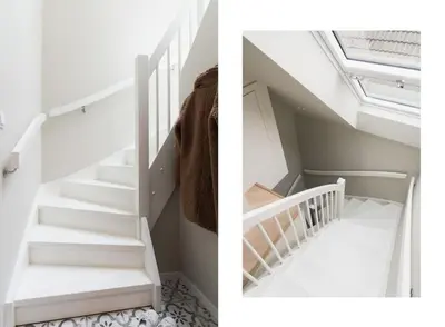 a staircase in a house with a skylight at Dinbnb Apartments I Mid-City Luxury with Mini Balcony and Smart TV & Sound System in Bergen