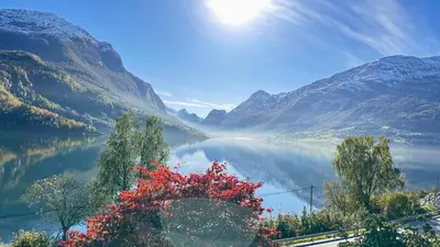 a view of a lake in a valley with mountains at Panorama #CasaSolvik #Loen in Loen