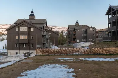 a group of buildings with snow on the ground at Høyfjellsgrend 961, 29 B in Trysil