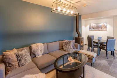 a living room with a couch and a table at Høyfjellsgrend 961, 29 B in Trysil