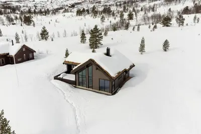 an aerial view of a cabin in the snow at Tonningssætra Mountain Lodge in Stryn