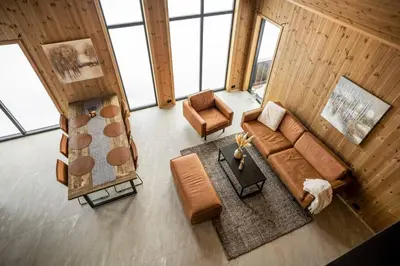 an overhead view of a living room with a couch and chairs at Tonningssætra Mountain Lodge in Stryn