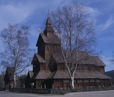 a large wooden building with a large tower at Luxury cabin in the mountains with all facileties in Sønstebø
