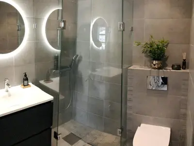 a bathroom with a shower with a toilet and a sink at 8 person holiday home in averøy-By Traum in Averoy