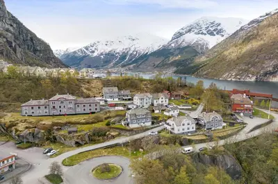 an aerial view of a town in a valley with mountains at Tysso Apartment in Tveit