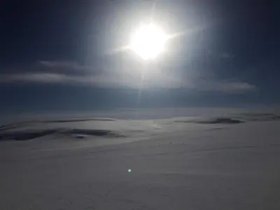 a sun in the sky over a snow covered field at 4 person holiday home in GEILO-By Traum in Geilo