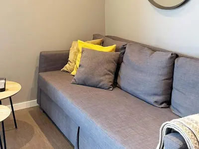 a couch with pillows on it in a room at 4 person holiday home in GEILO-By Traum in Geilo