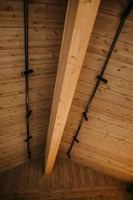 a room with wooden ceilings and wooden floors at Nydelig moderne hytte på Geilo Kikut med høy standard - 4 senger 6 gjester in Geilo