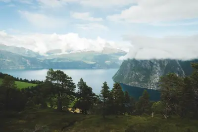 a view of a mountain with a blue lake at 7 Min to Fjord - Alpine Stay in Stranda in Stranda