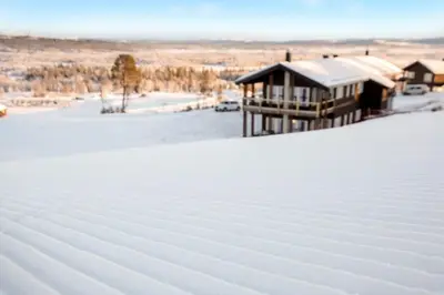 a house on top of a snow covered roof at Bualie - Golsfjellet - Biking, swimmming, hiking. High standard. in Gol
