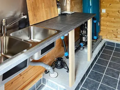 a kitchen with a sink and a counter top at 4 person holiday home in OMASTRAND-By Traum in Sanddal