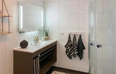 a bathroom with a sink and a shower at Amazing Home In Nordfjordeid With Wifi in Nordfjordeid