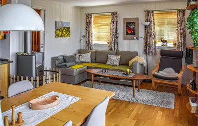 a living room with a couch and a table at Awesome Apartment In Rauland With Sauna in Rauland