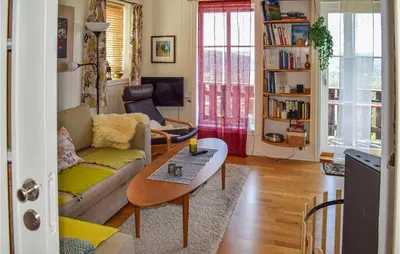 a living room with a couch and a table at Awesome Apartment In Rauland With Sauna in Rauland