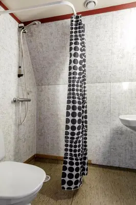 a shower curtain in a bathroom with a sink at Hallingparken in Gol