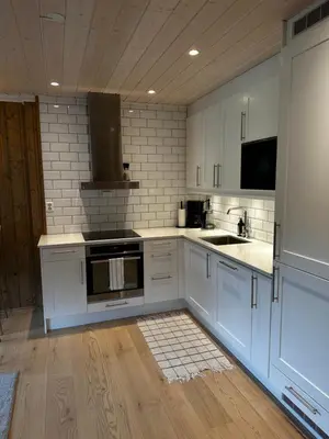 a kitchen with white cabinets and a sink at Nice apartment on Geilotunet, Close to city center in Geilo
