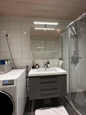 a bathroom with a sink and a shower at Nice apartment on Geilotunet, Close to city center in Geilo