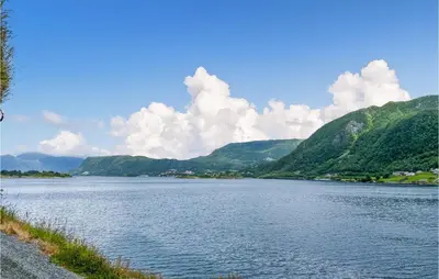 a view of a river with mountains in the background at Nice Home In Selje With Wifi in Stokke
