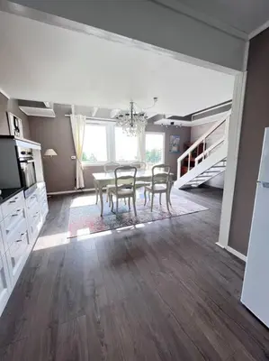 a kitchen with a table and chairs in a room at Moldegaard Farmhouse - Apartment C in Moldegard