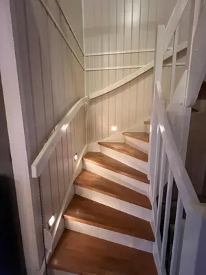 a staircase in a house with wooden floors at Røstad Apartment - with Kitchen and Free Parking in Trondheim