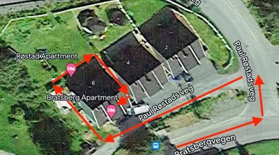 a map of a parking lot with red arrows at Røstad Apartment - with Kitchen and Free Parking in Trondheim