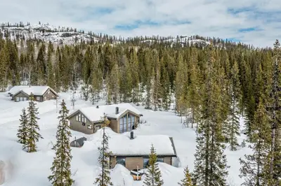an aerial view of a house in the snow at Private Room in Beautiful Mountain Home w/ Sauna in Beitostøl