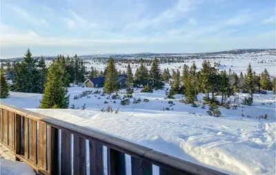 a winter view from the deck of a cabin at 5 Bedroom Gorgeous Home In Sjusjøen in Sjusjøen