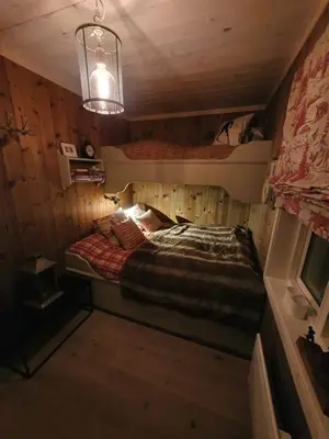 a small room with a bed in a cabin at Luxurious, well-Equipped and modern Cabin by the Cross-Country Ski Trails in Eggedal