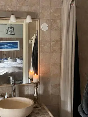 a bathroom with a sink and a mirror at Luxurious, well-Equipped and modern Cabin by the Cross-Country Ski Trails in Eggedal