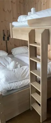 a couple of bunk beds next to a bed at Leiligheter på Fyri Resort - Hemsedal in Hemsedal