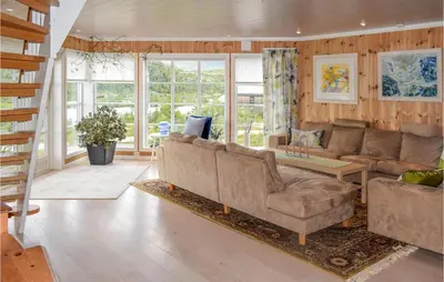 a living room with a couch and a table at Amazing Home In Eggedal With Kitchen in Eggedal