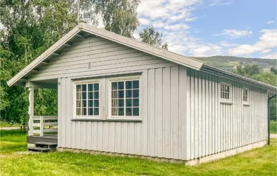 a small white building with a window on it at Gorgeous Home In Dovre With Wifi in Dovre